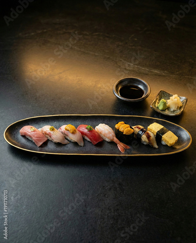 Luxury sushi platter on dark stone with premium Japanese presentation