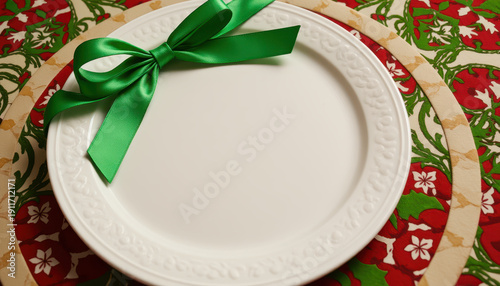 White plate green ribbon holiday table Christmas decoration festive place dining setting celebration red cloth winter season empty dish Holiday table with white plate and green ribbon decoration