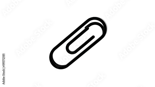 A close-up view of a black paper clip laying diagonally on a white background