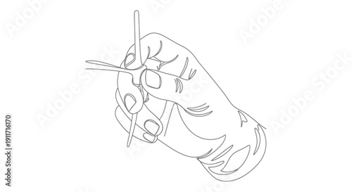 Close up of a hand holding a sewing needle and thread.