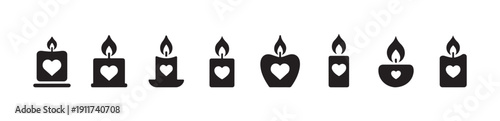 Row of eight different styled heart candles burning with small flames for romantic occasion