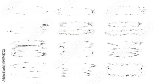 abstract black brush strokes and ink splatters on a white background versatile grunge texture elements for design overlays.