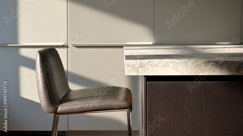 Single bar stool beside kitchen island edge in modern interior with left copy space