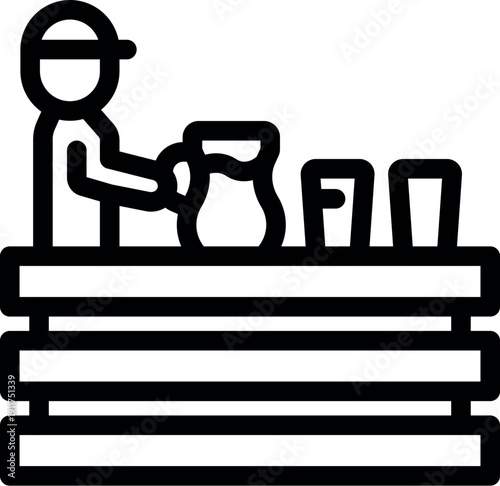 Street vendor pouring beverage from pitcher into cups at outdoor wooden stall