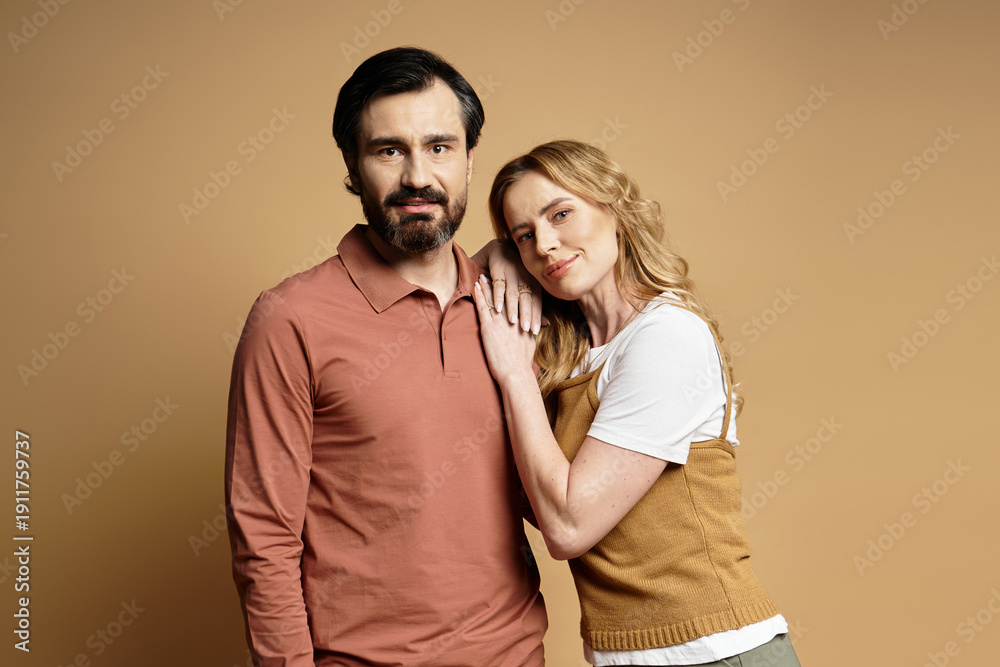 Fototapeta premium Stylish couple expressing love and affection in a warm, inviting setting