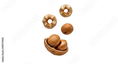 Close-up of shelled and unshelled walnuts on black background, perfect for cooking and healthy snacks