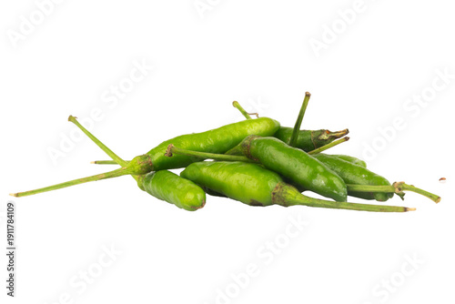 Fresh green chili peppers on a white background, vibrant and spicy vegetables for cooking and healthy eating