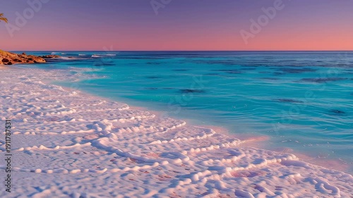 Tranquil coastal scene featuring vivid turquoise ocean waves gently crashing onto a pink sand beach under a mesmerizing sunset sky. the gradient hues of orange and pink reflect over the calming sea, c