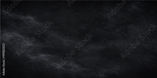 A dramatic motion of dark steam and smoke on a black background creates a moody texture resembling a stormy night sky or deep space fog for a cinematic design backdrop
