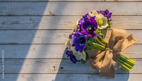 Delicate purple anemones bouquet with green foliage high resolution picture