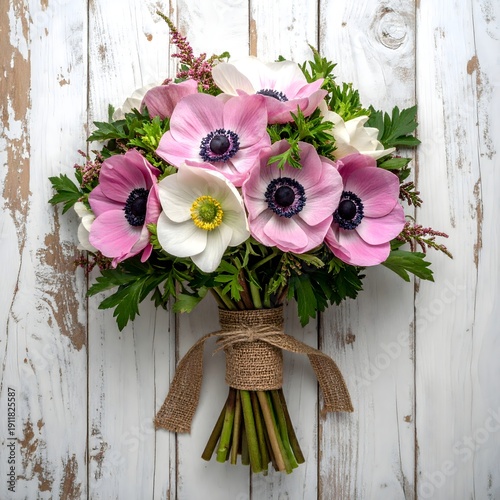 Elegant anemone arrangement on distressed white planks high resolution picture