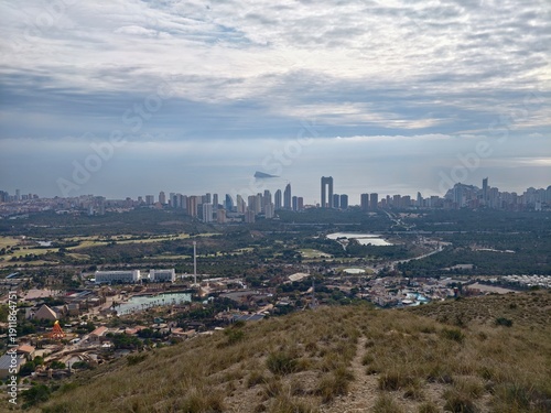 Vast hillside panorama showcasing rapid growth and development within coastal urban environment