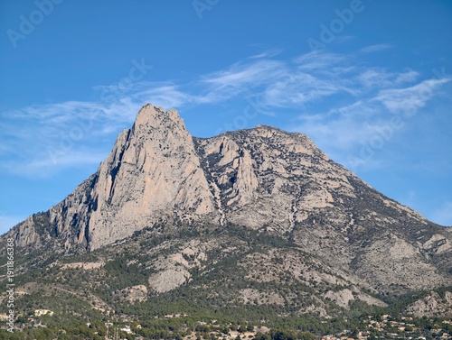 Принти на полотні Jagged summit with detailed rocky features, Majestic cliff face showcasing crags