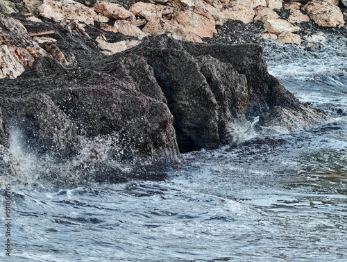 Dynamic ocean waves gradually sculpt resilient rocky coastlines amid ongoing environmental shifts