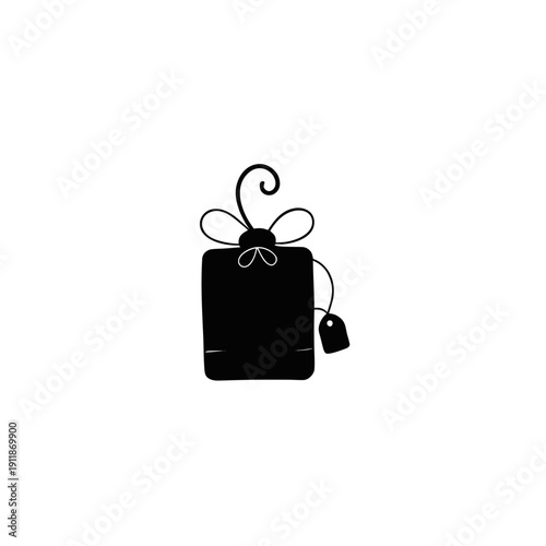 A stylish black gift bag tied with a decorative bow and a small tag attached.