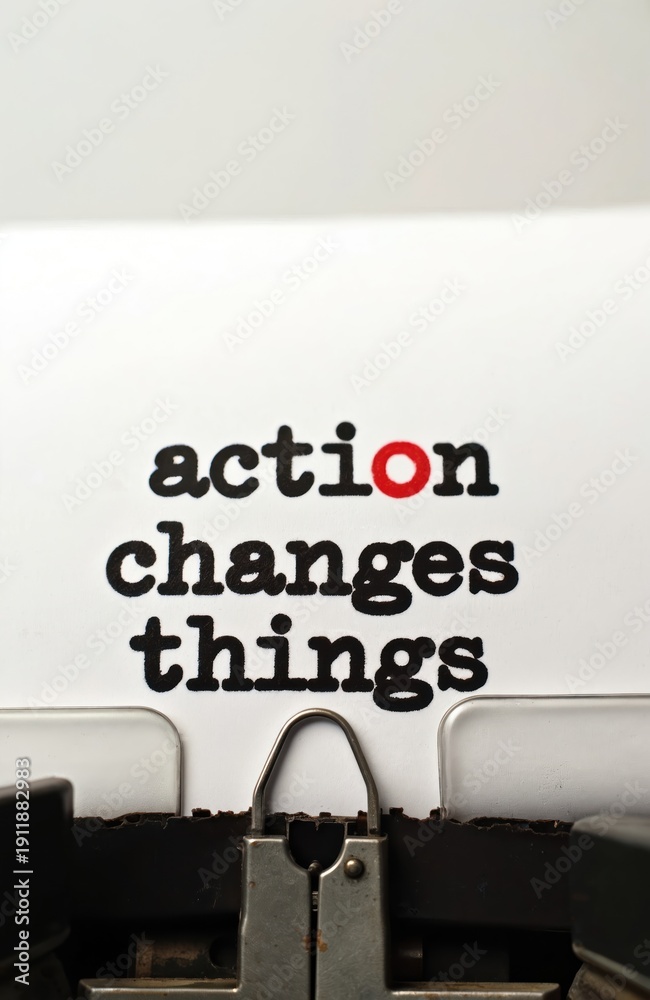 Fototapeta premium Action changes things text typed on retro typewriter. Message printed on paper motivates doing things and progress. Motivating quote for business or personal growth.