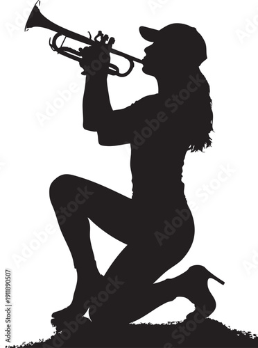 Woman playing trumpet while kneeling on one knee outdoors in silhouette
