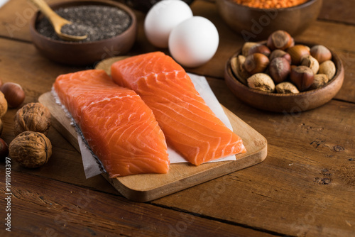 Selection food sources of omega 3 and unsaturated fats. Super food salmon, eeg, nuts, chia seeds, avocado.