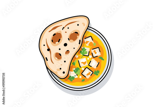 A delicious and savory Indian dish featuring paneer cubes in a rich curry sauce, served with warm, fluffy naan bread