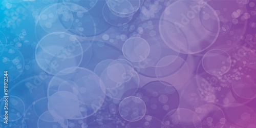 Abstract background with blue and purple gradient and bokeh effect.