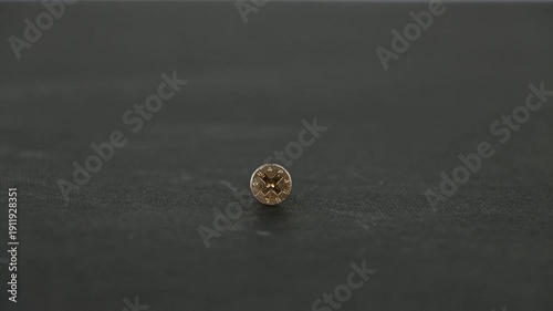 Close Up of Drywall and Wood Screws Turning in Motion