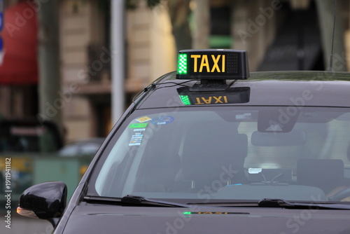 Photography Taxi waiting on the street in Barcelona during daytime hours