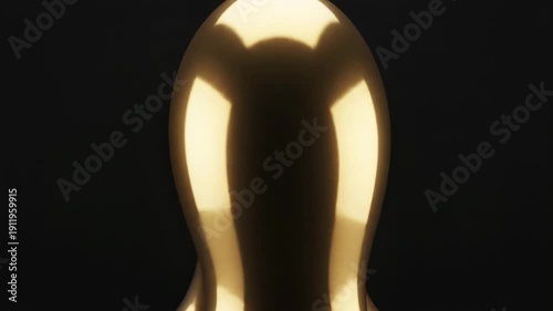 A close-up view of a shiny, reflective, and smooth surface with a flower-like pattern
