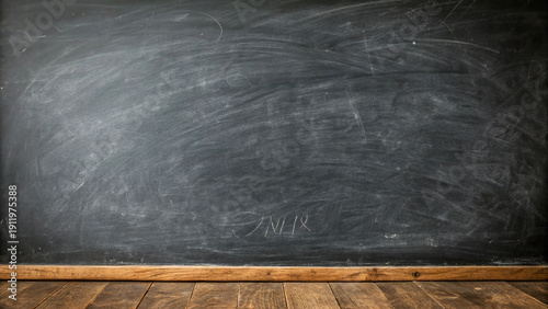 Billede på lærred Empty, wellused dark chalkboard background with chalk dust and a wooden floor le