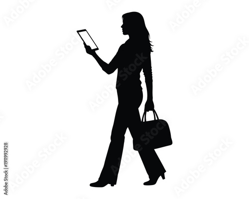 Silhouette of a businesswoman walking with tablet and briefcase