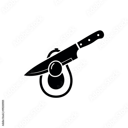 Knife Removing Pit from Avocado Half Silhouette