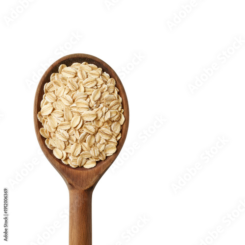 Wooden spoon filled with rolled oats
