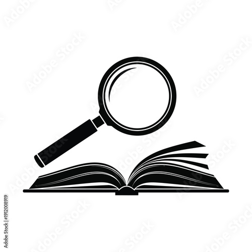 Magnifying glass examining an open book