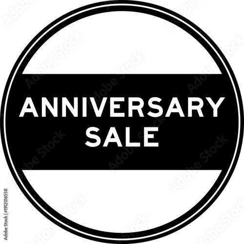 Black color round seal sticker in word anniversary sale on white background