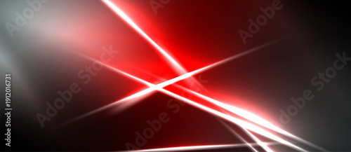Abstract red light streaks intersect, creating dynamic energy. Dark background emphasizes bright illumination, modern design.