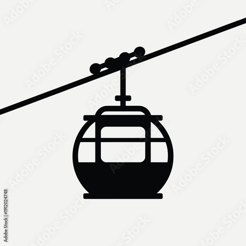 A simple black silhouette of a cable car on a wire
