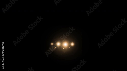 Car headlights shine in the dark