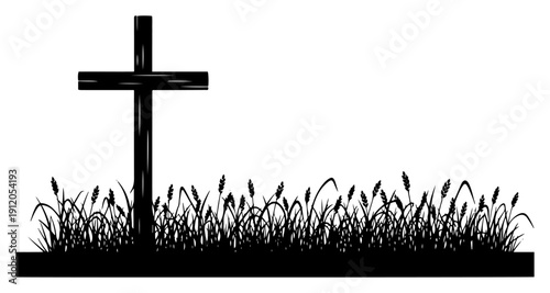 Christian wooden cross standing in a field of tall grass silhouette landscape