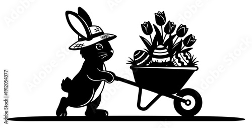Cute Easter bunny wearing a straw hat pushing a wheelbarrow filled with decorated eggs and tulips