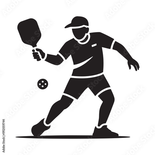 Silhouette of a pickleball player preparing to hit the ball