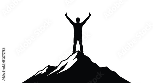 Silhouette of a person with arms raised atop a mountain peak