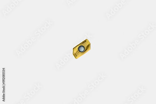 Tableau sur toile Golden coated carbide turning insert on a white background, representing precise