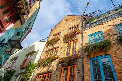 London, UK - 16 April 2022: Brightly painted buildings and window frames of Neal’s Yard in Covent Garden, London, UK.