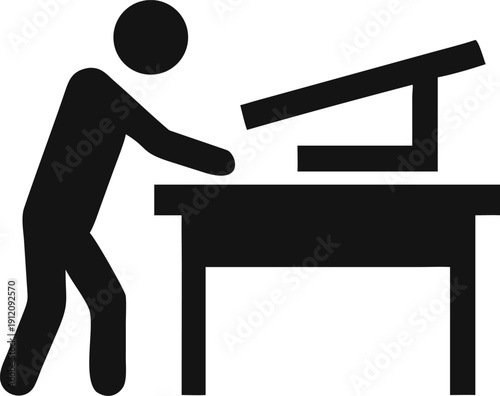 Black silhouette icon of a person working diligently at a desk with an inclined drafting board