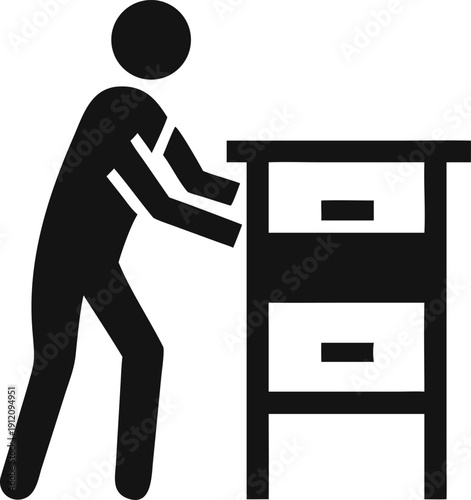 Individual Person Carefully Pushing or Moving a Heavy Cabinet with Drawers