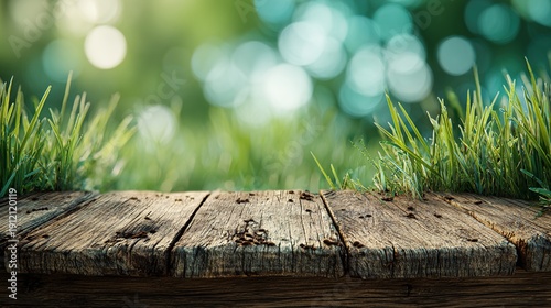 Wooden Table in Nature's Embrace: A rustic wooden table sits at the forefront, gently embracing the vibrant touch of nature, where lush green grass and soft bokeh in background.