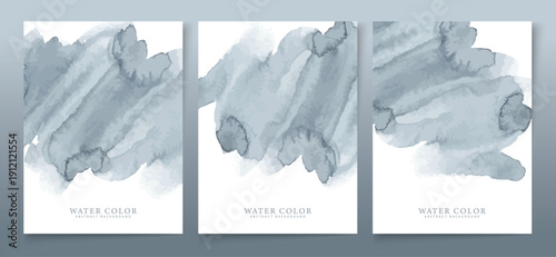 Subtle collection of three vertical watercolor abstract banners featuring soft, cool gray-blue brushstrokes on clean white backgrounds for design.