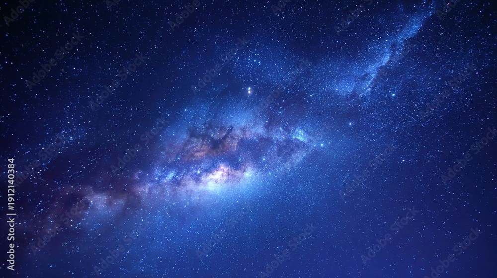 Fototapeta premium Cosmic Tapestry: A mesmerizing view of the night sky, showcasing a vibrant array of stars and nebulas, offering a glimpse into the vastness of the universe.