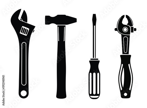 Silhouette of four basic hand tools for construction and repair