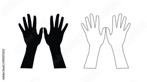 Two pairs of hands one dark and one light in a striking silhouette