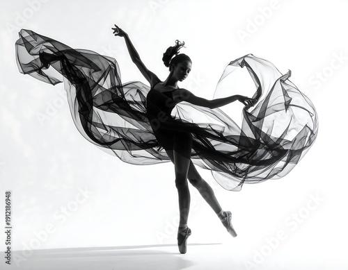 Minimalist ballet dancer captured midair with flowing fabric high resolution photo